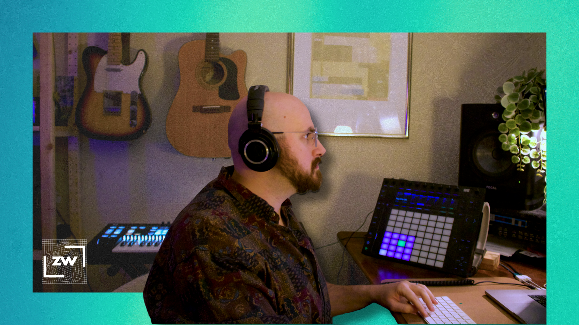 Image of me with headphones sitting at my desk