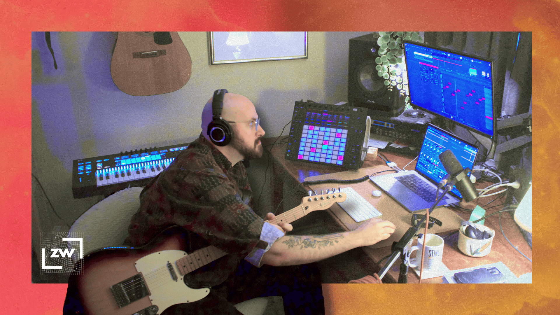 photo of me operating my computer while holding a telecaster