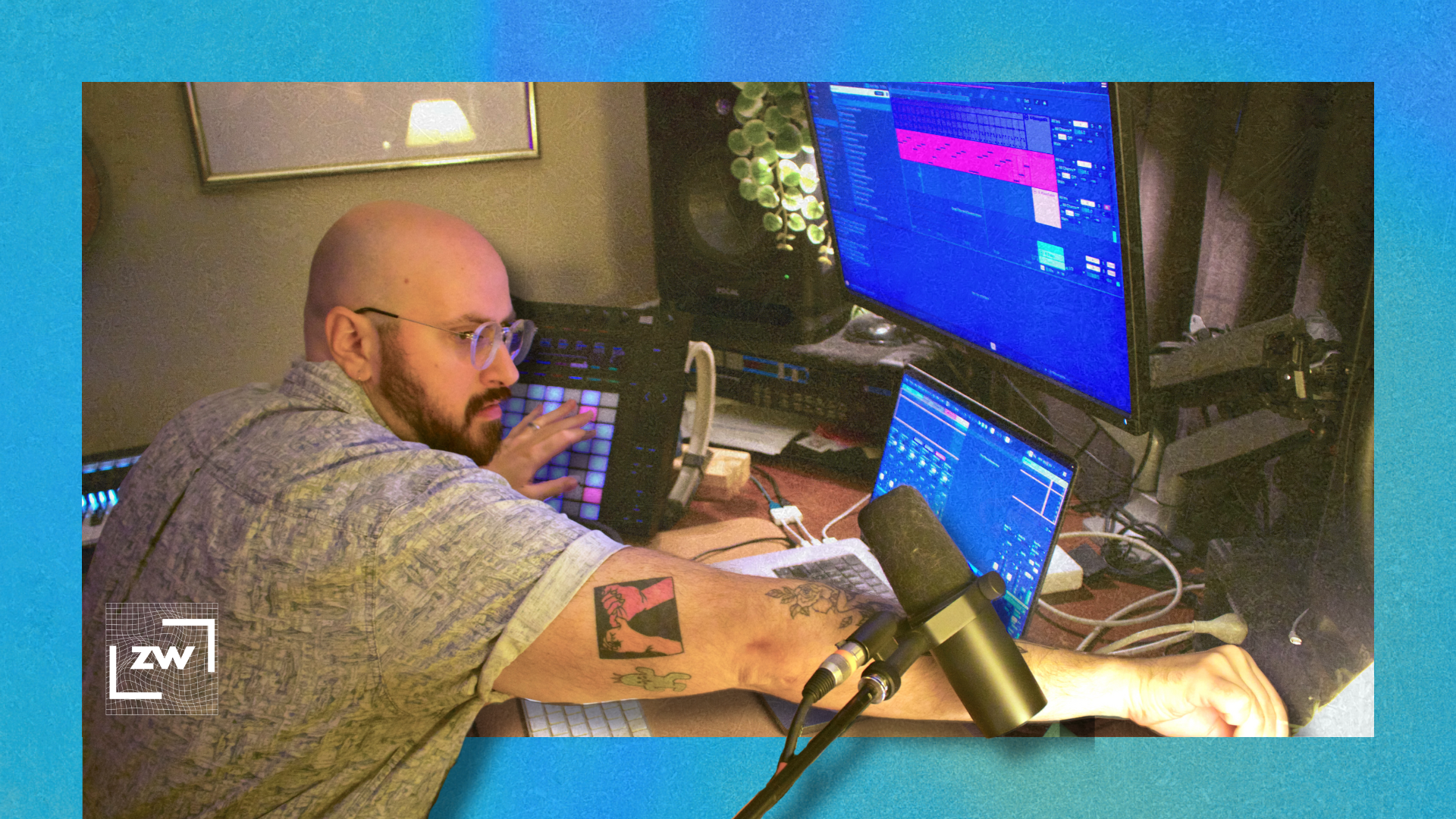 Image of me at my desk reaching for the volume knob on my audio interface while playing my ABleton Push 2